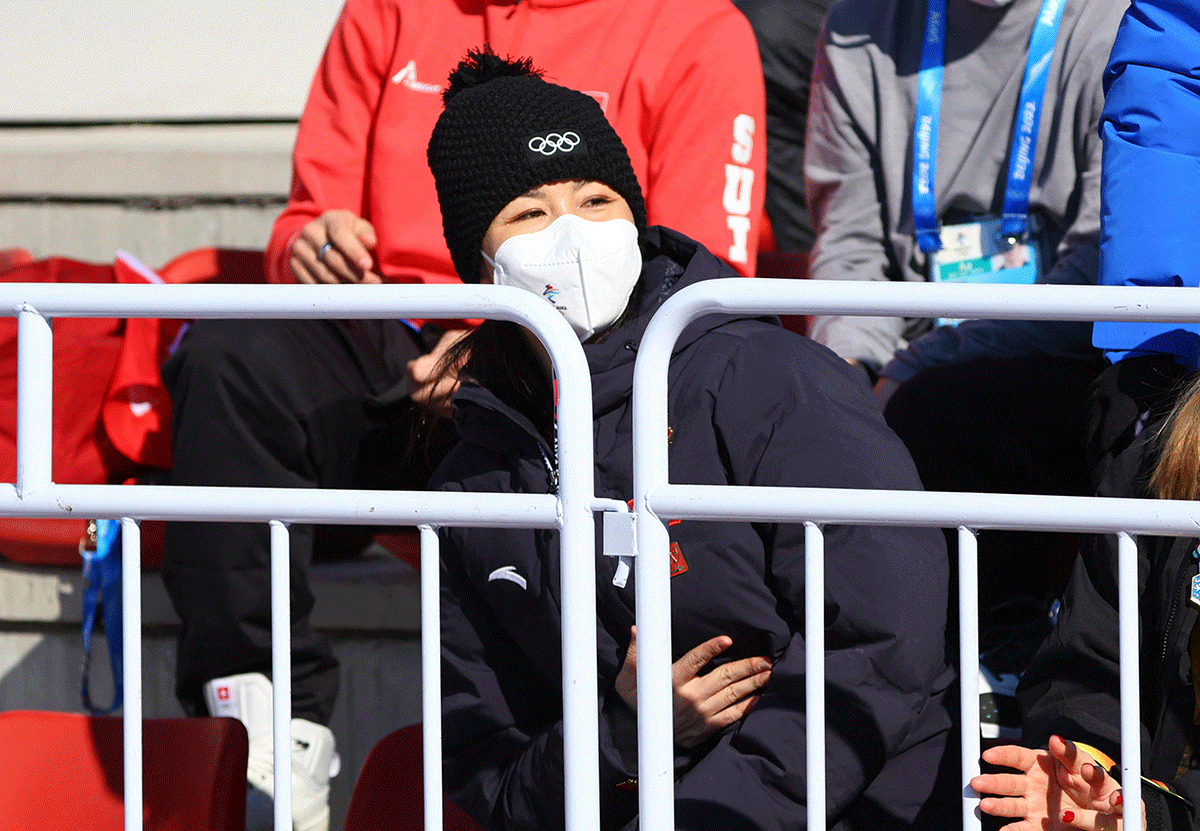 China's Peng Shuai wearing a face mask watches the Freestyle Skiing - Women's Freeski Big Air Final at Big Air Shougang, Beijing on Tuesday