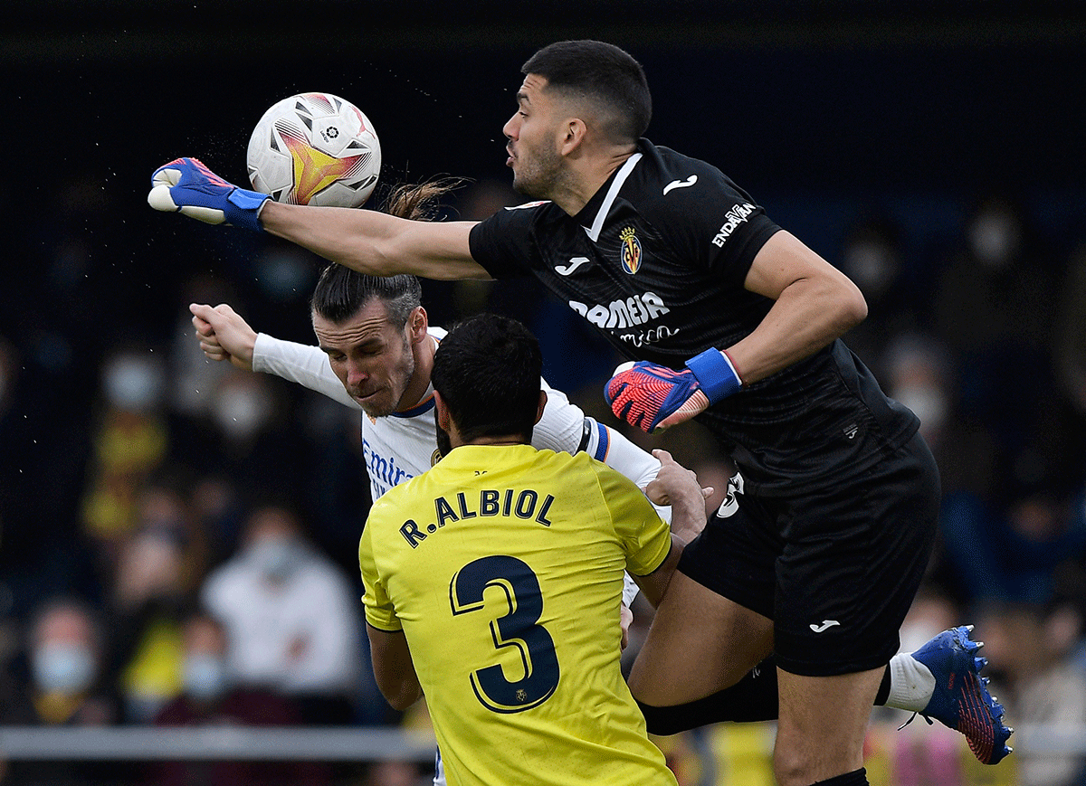 Real Madrid's Gareth Bale tries to head the ball as Villarreal's Geronimo Rulli punches it out during  their La Liga match at Estadio de la Ceramica, Villarreal on Saturday 