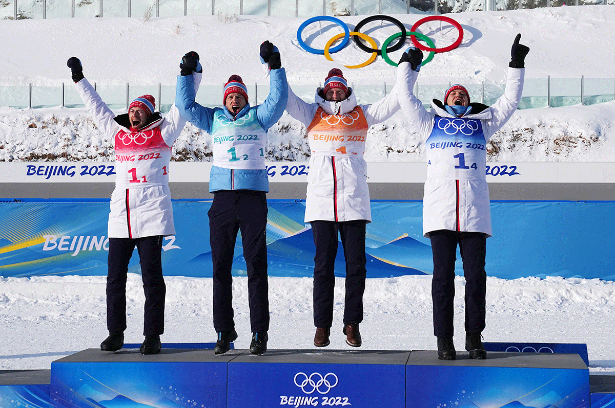 Norway's gold medallists Sturla Holm Laegreid, Tarjei Boe, Johannes Thingnes Boe and Vetle Sjaastad Christiansen celebrate on the podium after winning the  Biathlon Men's 4x7.5km Relay at National Biathlon Centre, Zhangjiakou on Tuesday