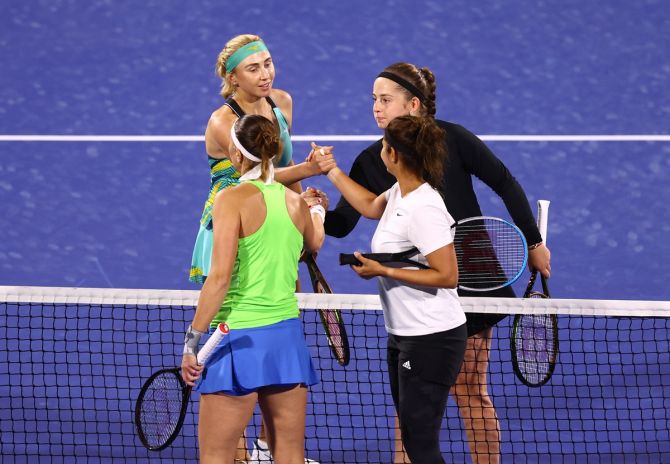 Lydudmyla Kichenok and Latvia's Jelena Ostapenko shake hands with the Czech Republic's Lucie Hradecka and India's Sania Mirza after the women's doubles semi-finals of the Dubai Duty Free Championships, at Dubai Duty Free Tennis Stadium, on Friday.