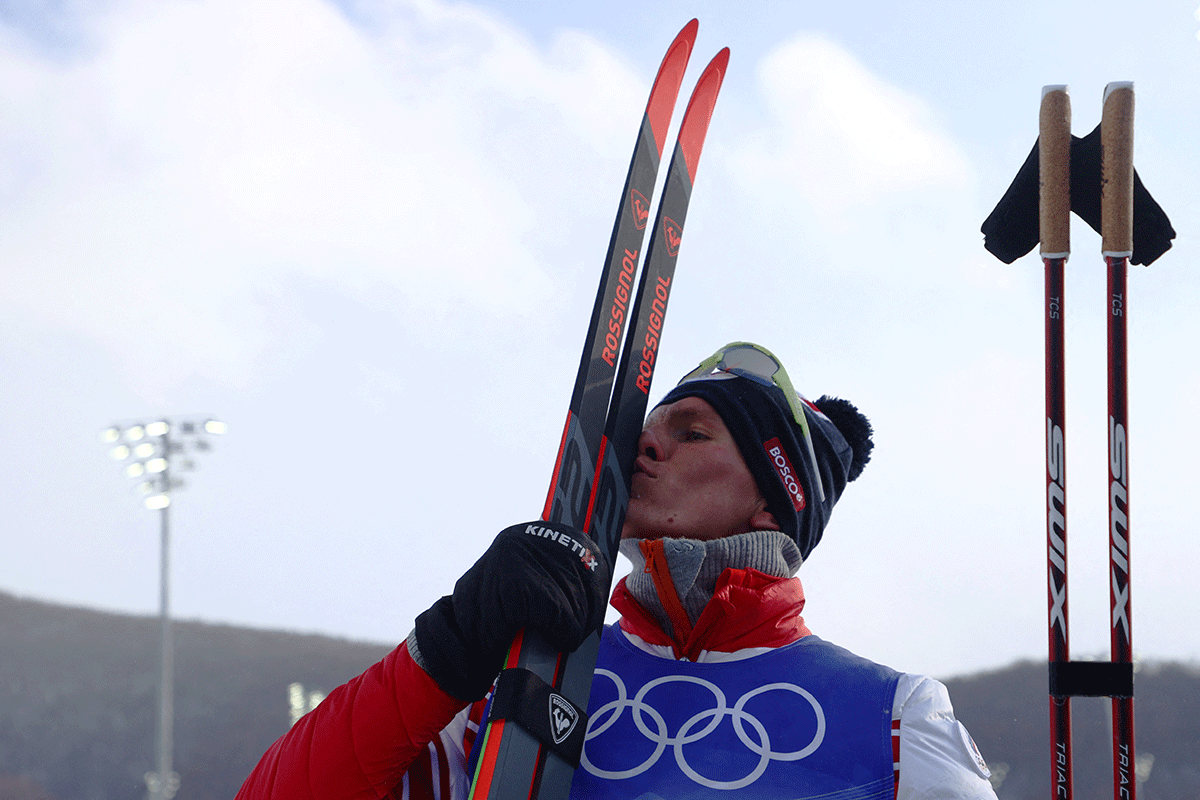 Alexander Bolshunov of the Russian Olympic Committee celebrates winning gold in the Cross-Country Skiing men's 50km mass start free event at National Cross-Country Centre in Zhangjiakou.