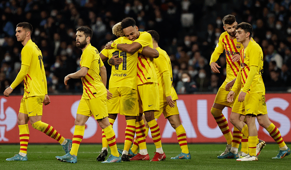 FC Barcelona's Pierre-Emerick Aubameyang celebrates with teammates after scoring their fourth goal against Napoli at Stadio Diego Armando Maradona, Naples 