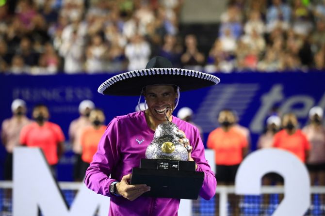 Spain's Rafael Nadal celebrates with the trophy after beating Britain's Cameron Norrie in the final of the ATP 500 Mexican Open, at Acapulco, on Saturday.