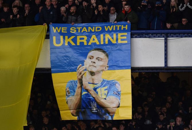 Fans hold a banner in support of Ukraine before the Premier League match between Everton and Manchester City, at Goodison Park, Liverpool.