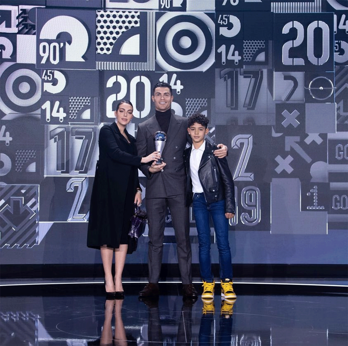 Cristiano Ronaldo celebrates winning the FIFA Special Best Award with his partner Georgina Rodriguez and his son Cristiano Ronaldo Jr on Monday