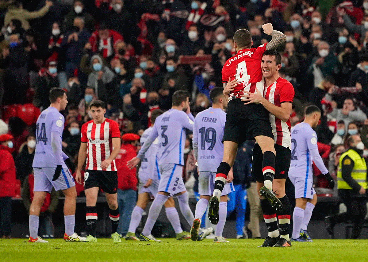 Athletic Bilbao's Inigo Martinez celebrates with teammates after beating Barcelona in their  Copa del Rey Round of 16 match in San Mames, Bilbao, Spain, on Thursday 