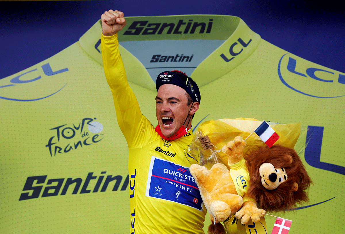 Quick-Step Alpha Vinyl Team's Yves Lampaert celebrates on the podium wearing the yellow jersey after winning stage 1 of the Tour de France Copenhagen to Copenhagen - Copenhagen, Denmark on Friday