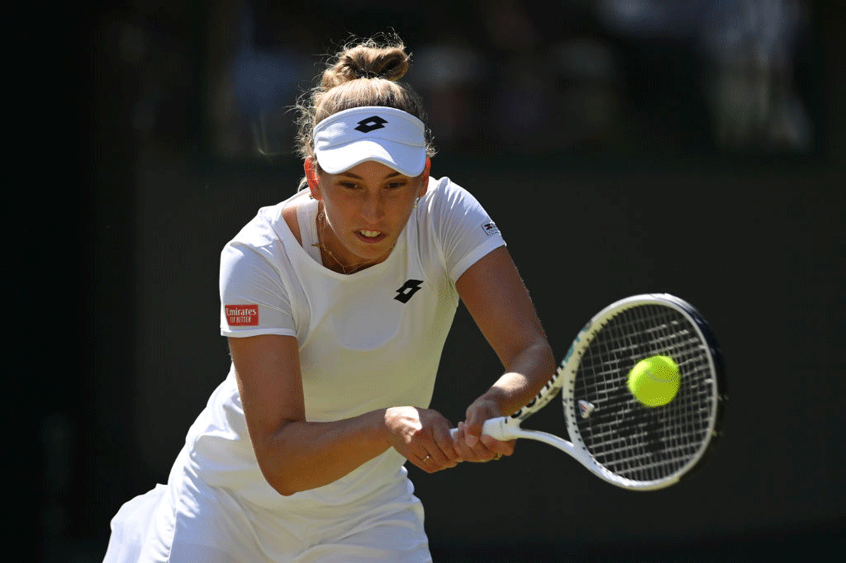 Elise Mertens of Belgium plays a backhand against Angelique Kerber of Germany 