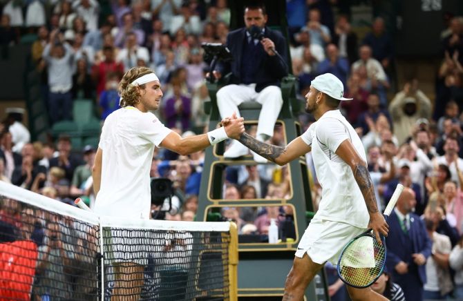 Australia’s Nick Kyrgios gives Greece’s Stefanos Tsitsipas a brief handshake after winning their third round match at the Wimbledon Championships on Saturday. 