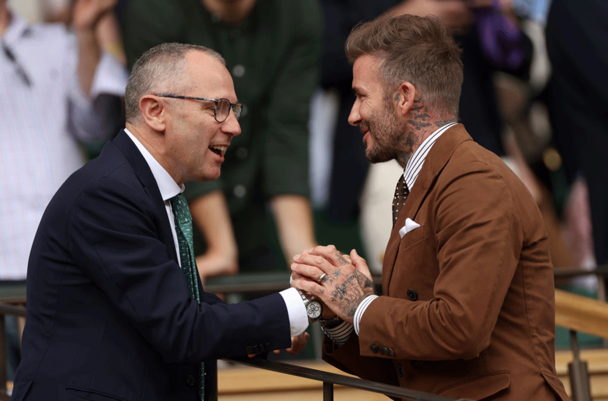 David Beckham greets Formula One Group CEO, Stefano Domenicali.
