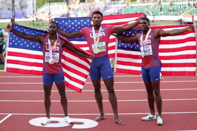 The United States' Trayvon Bromell (bronze), Fred Kerley (gold) and Marvin Bracy (silver) pose with thier medals from the men's 100m final on Day 2 of the World Athletics Championships.