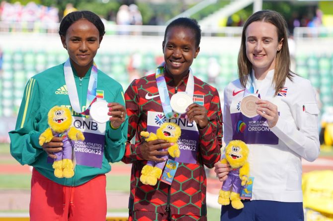 Ethiopia's Gudaf Tsegay (left), Kenya's Faith Kipyegon (centre) and Great Britain's Laura Muir pose with their medals from the women’s 1500m.