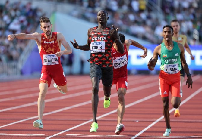 Kenya's Emmanuel Kipkurui Korir celebrates as he eases across the line to win his 800 metres heat ahead of second-placed Morocco's Elhassane Moujahid, third-placed Spain's Alvaro de Arriba and fourth-placed Ethiopia's Ermias Girma. 