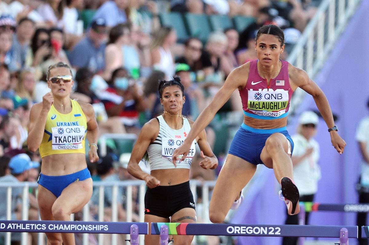 Sydney McLaughlin of the United States, Panama's Gianna Woodruff and Ukraine's Viktoriya Tkachuk in action during the  women's 400 metres hurdles semi-finals heat.