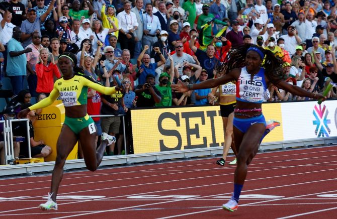 Twanisha Terry crosses the line ahead of Jamaica's Shericka Jackson to win the women's 4x100 metres relay final for the United States.
