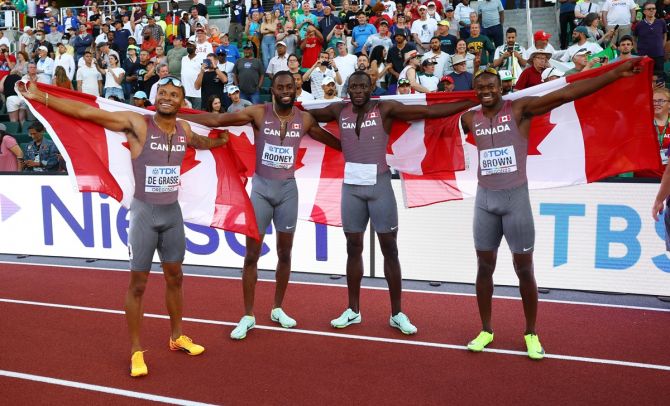 Andre De Grass, Aaron Brown, Jerome Blake and Brendon Rodney celebrate winning gold for Canada in the men's 4x100 metres at the World Athletics Championships, in Eugene, Oregon, on Saturday.