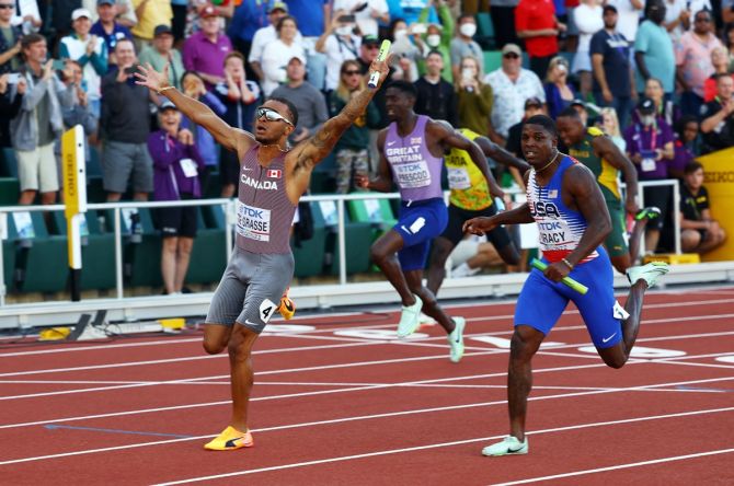 Andre De Grasse crosses the line first to clinch gold for Canada in the men's 4x100 metres relay final.