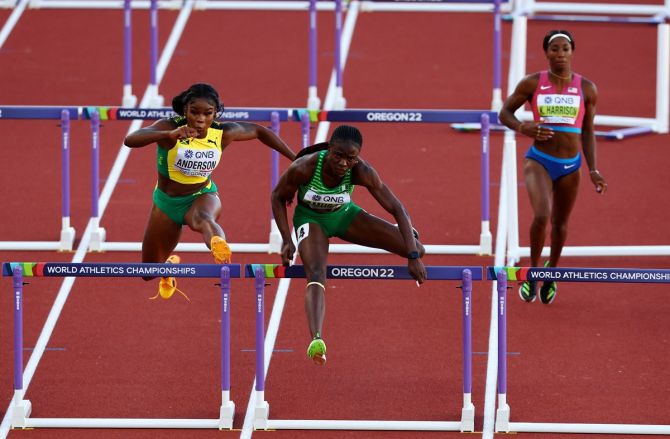 Nigeria's Tobi Amusan gets over the last hurdle ahead of Jamaica's Britany Anderson during the women's 100 metres hurdles final.