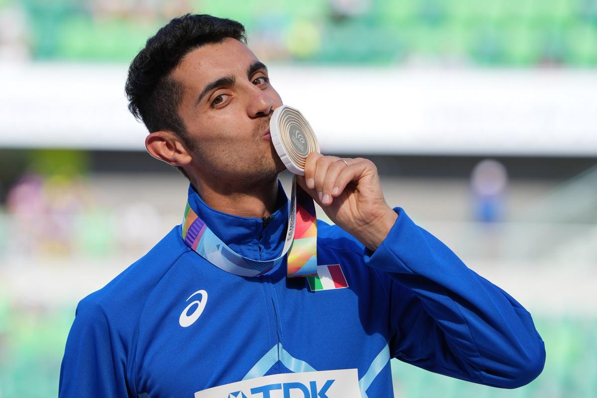 Massimo Stano celebrates with his gold medal.