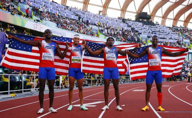 Bryce Deadmon, Michael Norman, Elija Godwin and Champion Allison of the United States pose after winning the men's 4x400 metres final at the World Athletics Championships in Eugene, Oregon, on Sunday.