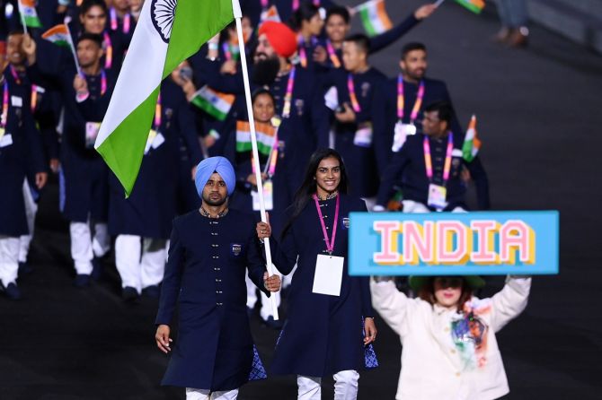 Double Olympic badminton medallist PV Sindhu and men's hockey team captain Manpreet Singh lead India out at the Commonwealth Games' Opening Ceremony in Birmingham on Thursday.