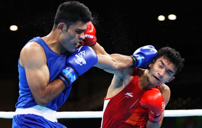 India's Shiva Thapa (right) lands a punch on Pakistan's Suleman Baloch during the men's light welterweight round of 32 bout on day one of the Birmingham 2022 Commonwealth Games