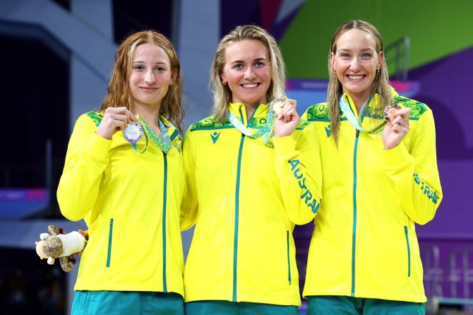 (L-R) Silver medallist Mollie O'Callaghan, gold medallist Ariarne Titmus and bronze medallist Madison Wilson pose with their medals after Australia's sweep in the women's 200m freestyle final at the Commonwealth Games on Friday.