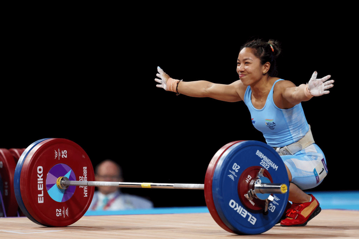 Saikhom Mirabai Chanu reacts after performing a clean & jerk