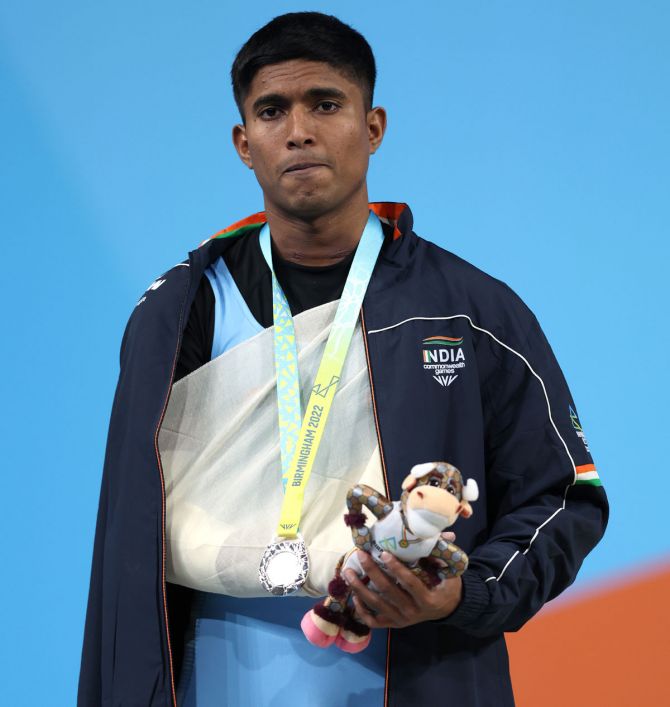 Sanket Sargar poses with the silver medal on Saturday