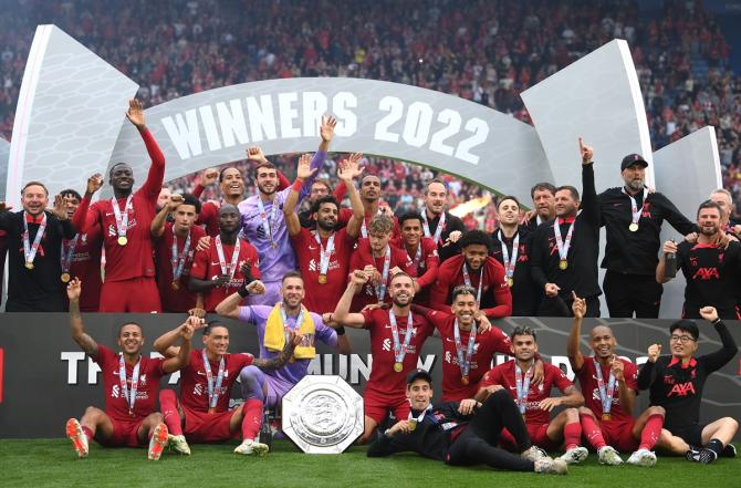 Liverpool players celebrate with the FA Community Shield after victory over Manchester City.