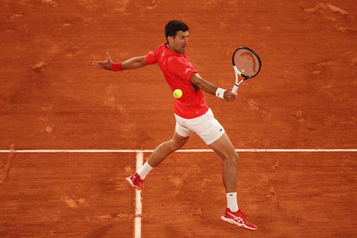 Serbia's Novak Djokovic plays a backhand return