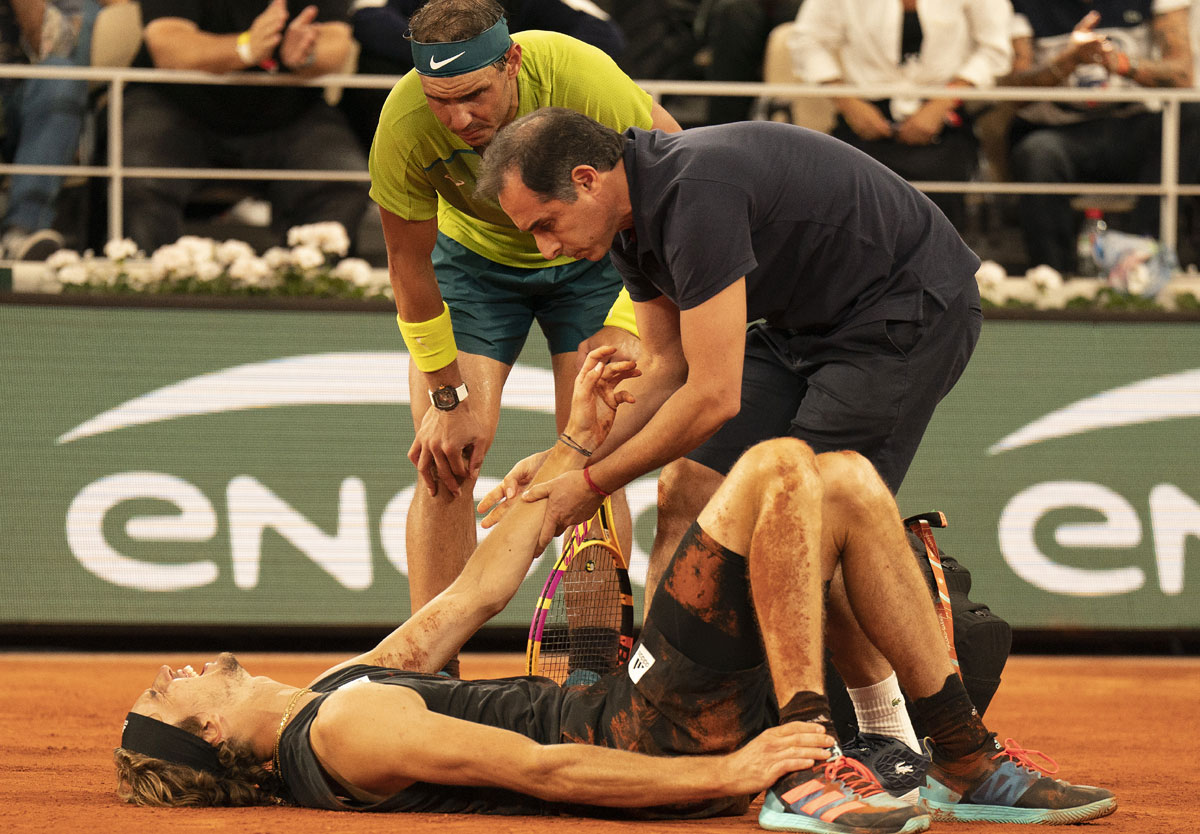 Rafael Nadal checks on the injured Alexander Zverev during their French Open semi-final on Saturday