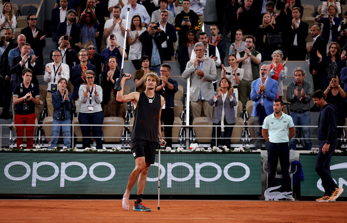 Alexander Zverev leaves the court on crutches after being forced to retire following an injury during the French Open semi-final match against Rafael Nadal last Friday.