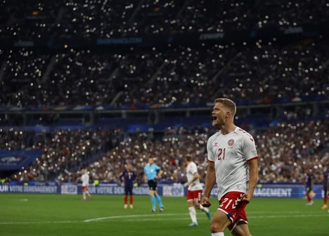 Andreas Cornelius celebrates scoring Denmark's first goal. 