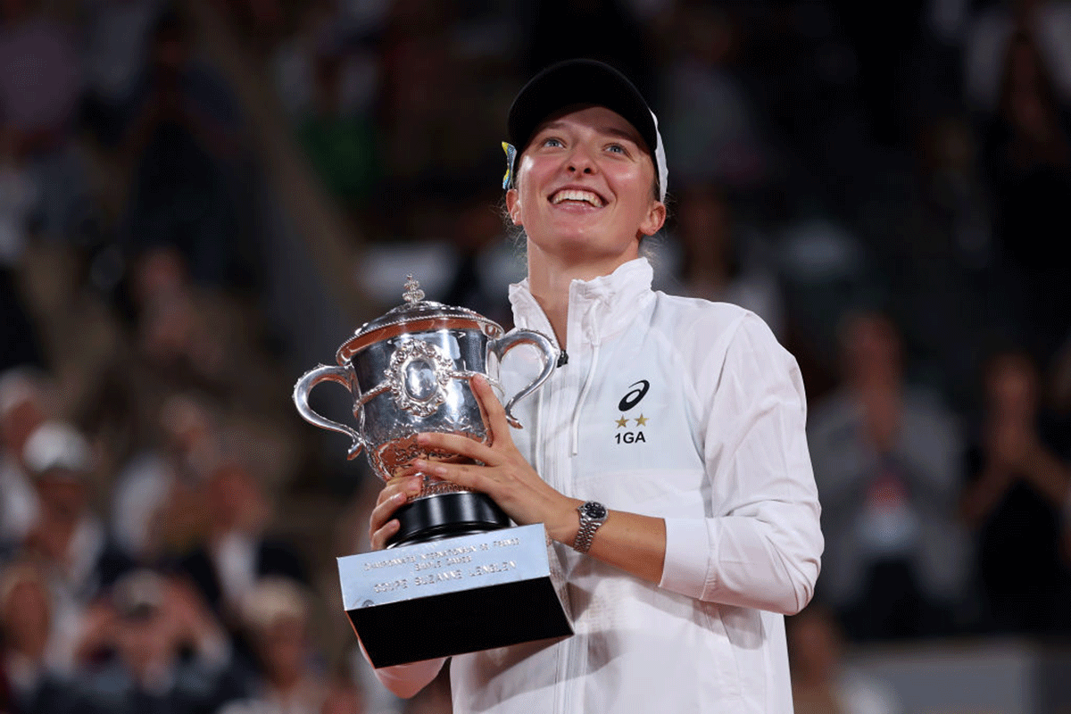 Poland's Iga Swiatek celebrates with the trophy after beating USA's Coco Gauff to win the French Open women’s final