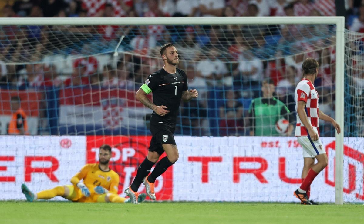 Marko Arnautovic celebrates scoring Austria's first goal against Croatia, at Stadion Gradski vrt, Osijek, Croatia.