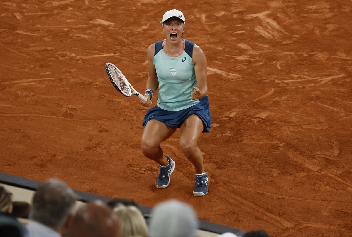 Poland's Iga Swiatek celebrates winning match-point in the French Open women's singles final against Cori Gauff at Roland Garros, Paris, on Saturday.