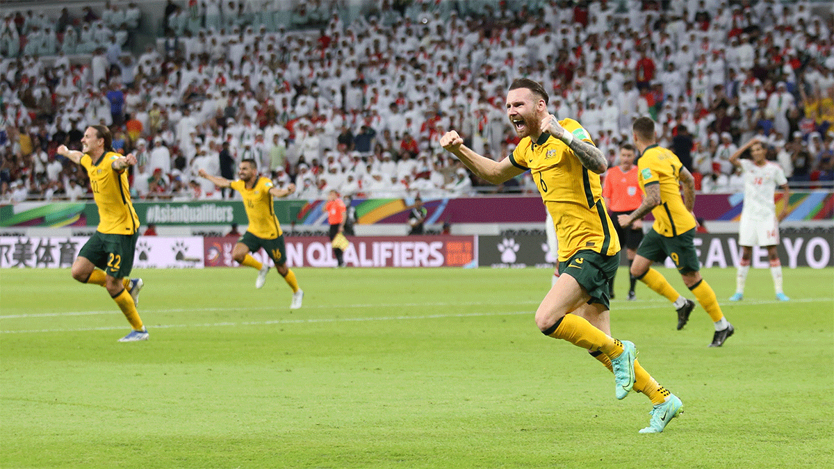 Australian footballers celebrate victory