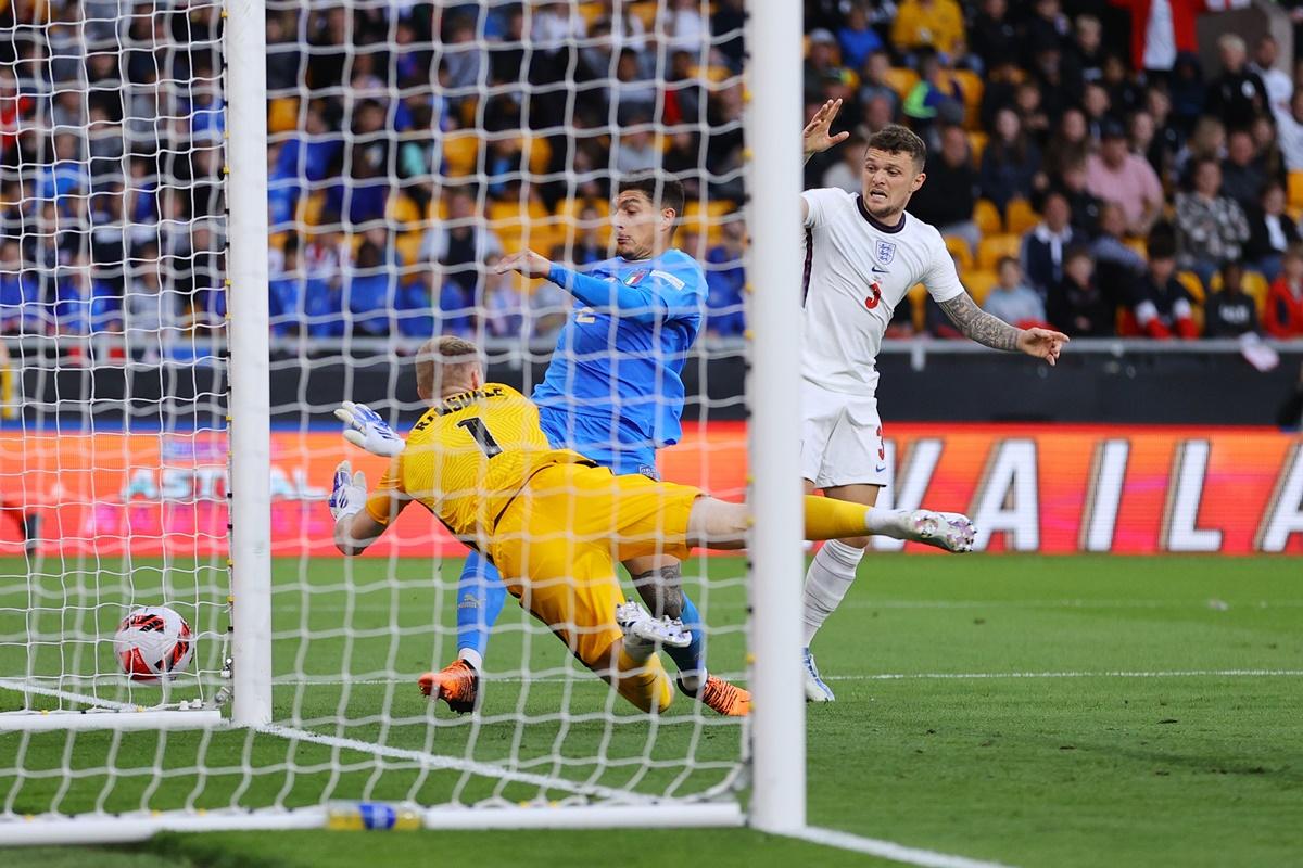 England's goalkeeper Aaron Ramsdale thwarts Italy's Giovanni Di Lorenzo as teammate Kieran Trippier looks on during the UEFA Nations League A Group 3 match at Molineux, in Wolverhampton, on Saturday.