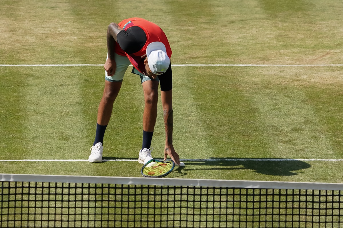 Nick Kyrgios breaks his racket during the semi-final.