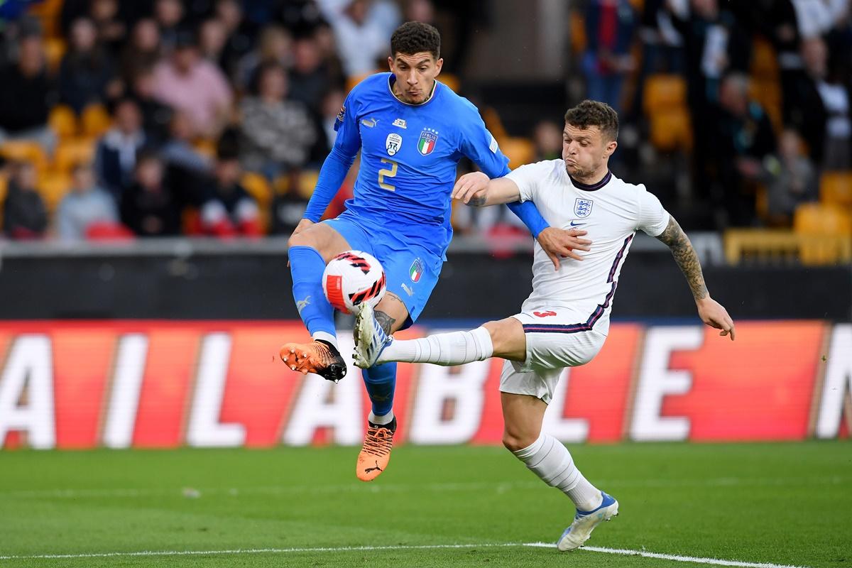 Italy's Giovanni Di Lorenzo tries to get past England defender Kieran Trippier.