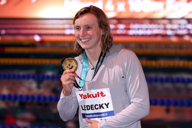 Katie Ledecky of the United States shows off her medal from the wmen's 800m freestyle on Day 7 of the Budapest 2022 FINA World Championships, at Duna Arena in Budapest, Hungary, on Friday.