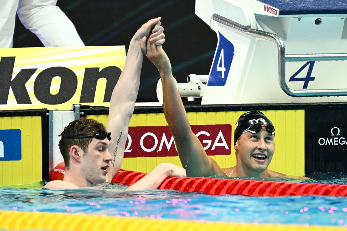 The United States' Hunter Armstrong and Justin Ress celebrate finishing second and first before Ress is disqualified.