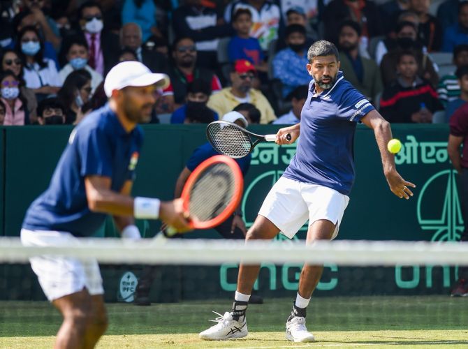 India's Rohan Bopanna and Divij Sharan in action against Denmark's Frederik Nielsen and Johannes Ingildsen during the Davis Cup World Group 1 play-off match, in New Delhi, on Saturday.