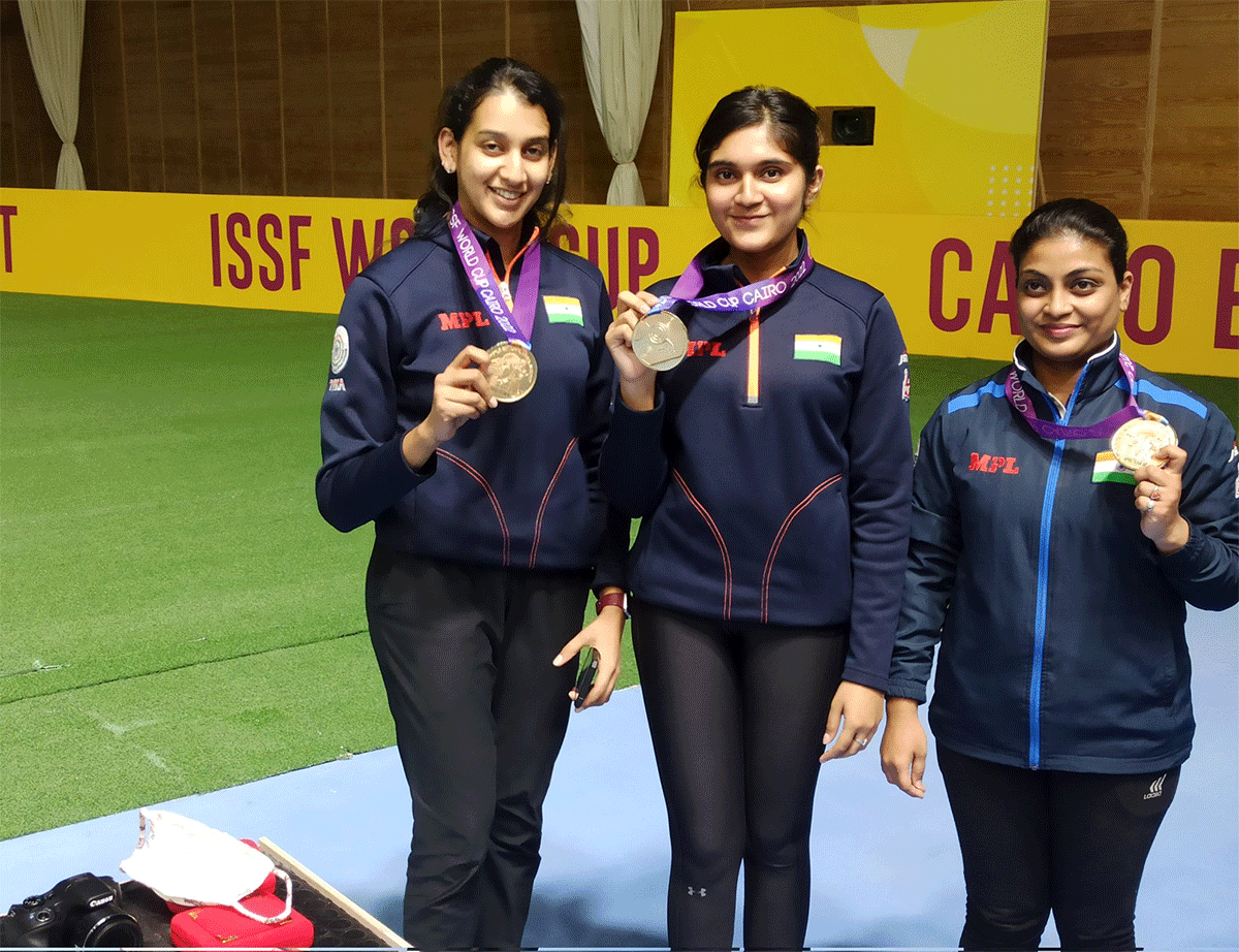 Rahi Sarnobat, Esha Singh and Rhythm Sangwan with their gold medals after winning the women's 25m pistol team event at the ISSF World Cup in Cairo on Sunday