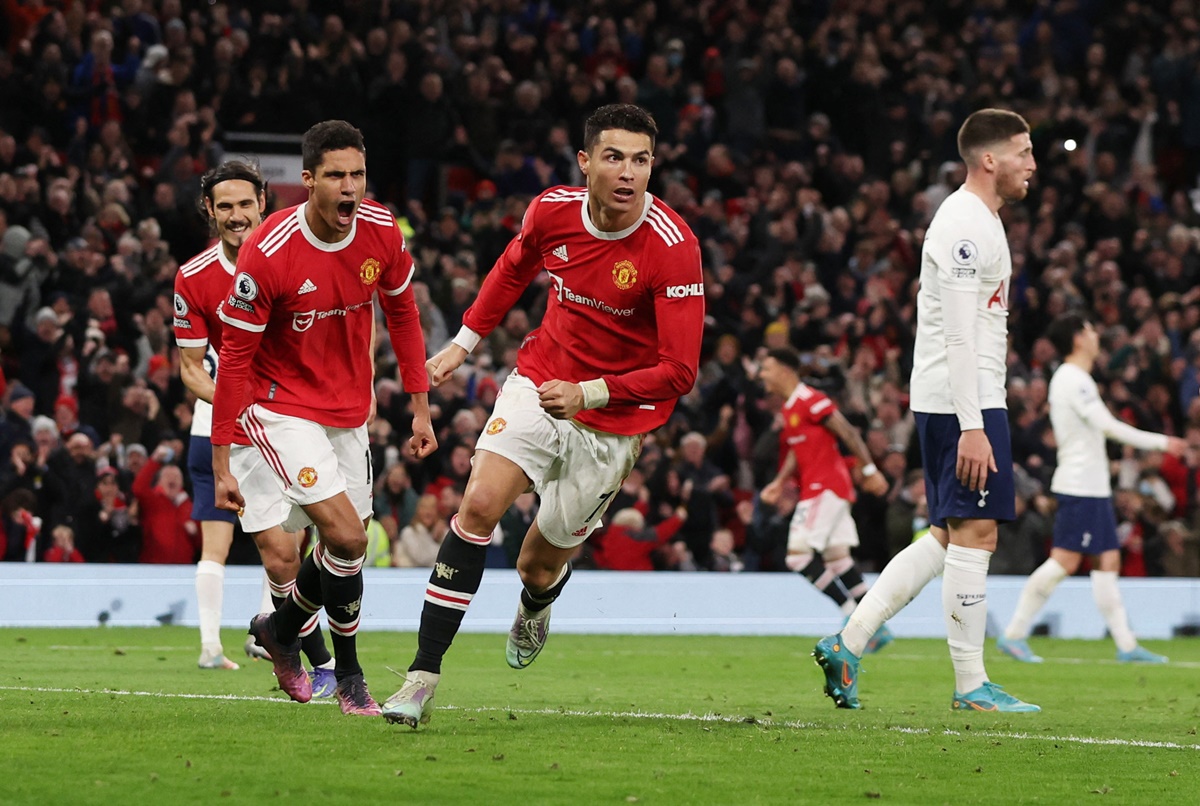 Cristiano Ronaldo celebrates scoring Manchester United's third goal.
