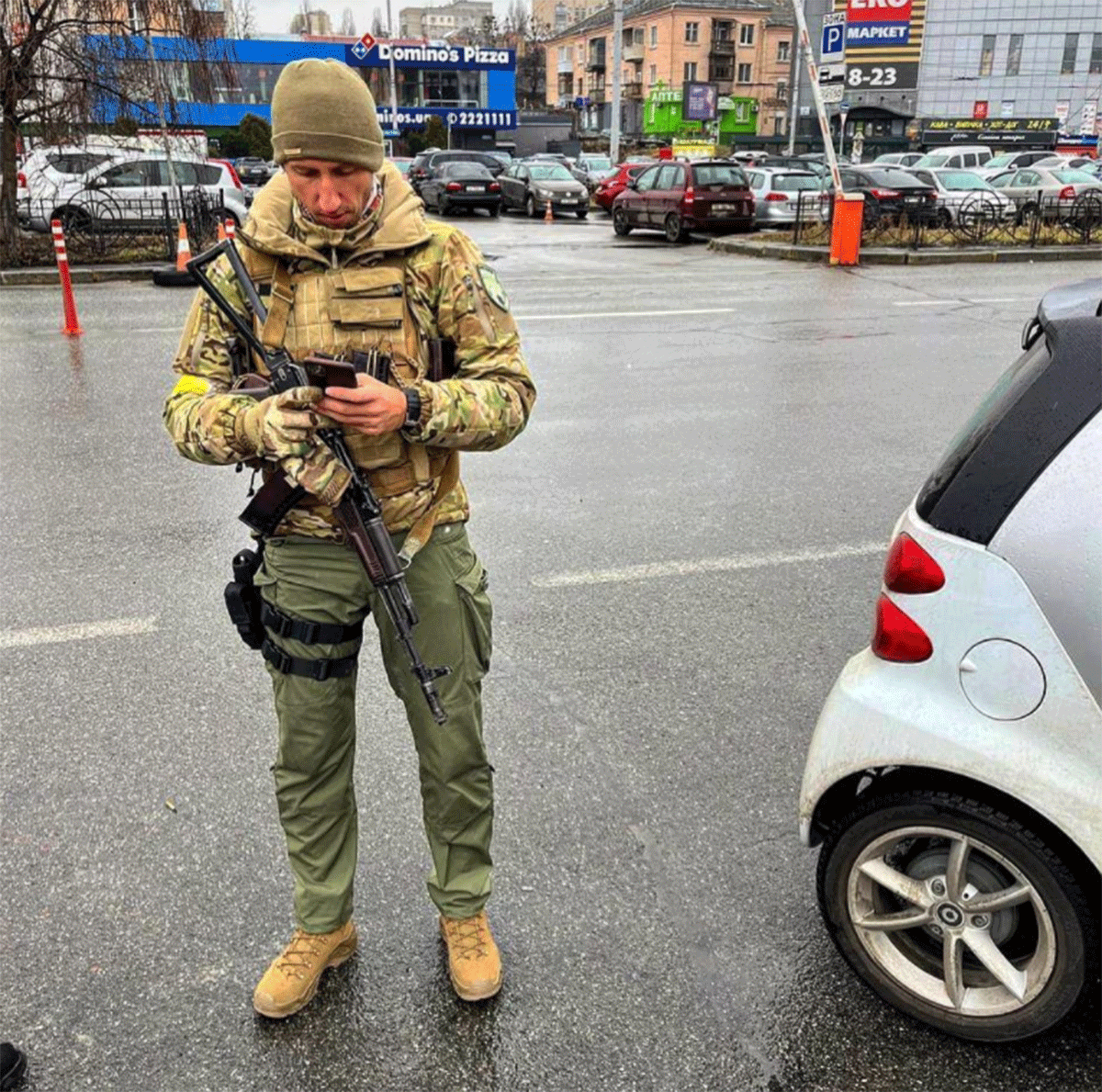 Former pro tennis player Sergiy Stakhovsky in in military fatigues and with a Kalashnikov assault rifle, patrol a street in Kyiv 