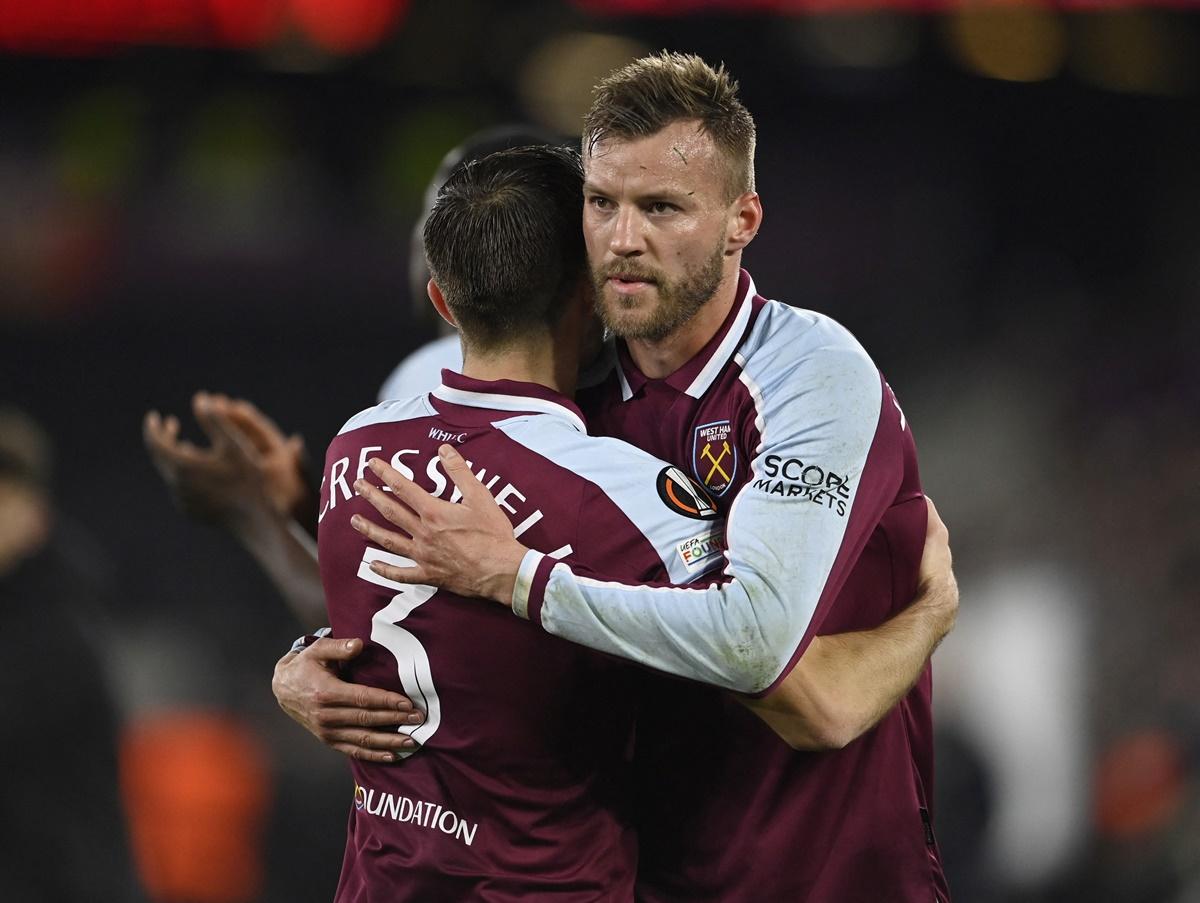 West Ham United's Andriy Yarmolenko celebrates with Aaron Cresswell after Thursday's Europa League Round of 16 Second Leg against Sevilla, at London Stadium, Britain, on Thursday. 