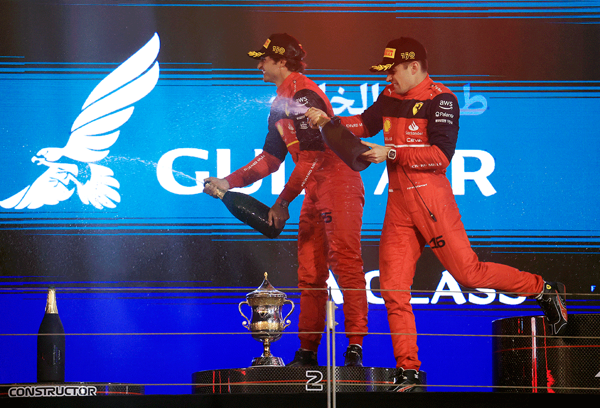 Ferrari's Charles Leclerc and Carlos Sainz Jr. celebrate their 1-2 finish on the podium