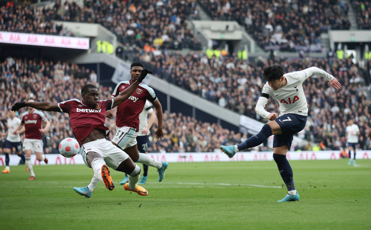 Tottenham Hotspur's Heung-Min Son scores their side's second goal beating West Ham United's Kurt Zouma during their match at Tottenham Hotspur Stadium in London